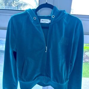 Green Jacket Juicy Couture. It was small on me. Cord is missing.